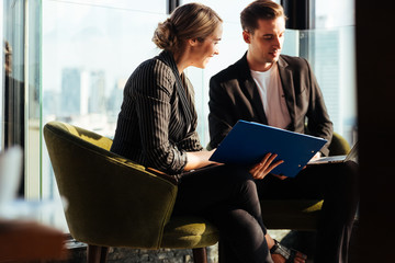 Corporate business team meeting discussion and startup concept. Successful businesspeople discussing together in conference room during meeting at modern business lounge high up in an office tower.