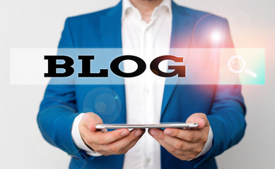 Aufkleber - Word writing text Blog. Business photo showcasing regularly updated website web page run by individual Man in the blue suite and white shirt holds mobile phone in the hand