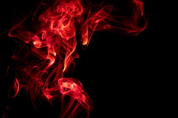 Red smoke on black background