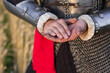 © Михаил Гута - hands of a medieval warrior, close-up, stained with earth. Holds the earth in his hands. hands in the ground