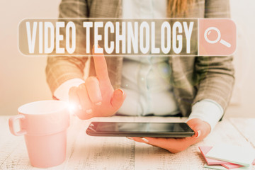 Fototapete - Handwriting text Video Technology. Conceptual photo recording and playing back of moving pictures and sound Business woman sitting with mobile phone and cup of coffee on the table