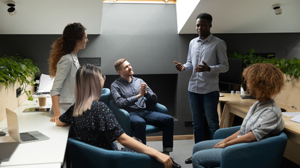 Wall Mural - African American employer lead team meeting in office