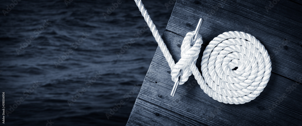 Boat Rope Secured To Cleat On Wooden Dock With Dark Water Below - obrazy, fototapety, plakaty 