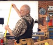 © nyul - Senior handyman with folding ruler at workshop