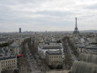 View of the Eiffel Tower as seen from the Arc de Triomphe in Paris, France on a cloudy day