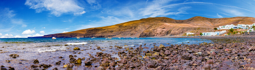 Wall Mural - Canary island and Spanish beach.Scenic landscape small fishing village Playa Quemada in Lanzarote