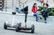 © Тарас Нагирняк - Whiteand black hoverboard or self-balancing scooter in the park close-up.