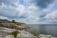 Rocky Cliffs Landscape On Texas Lake Shore On Cloudy Day