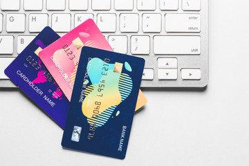 Wall Mural - Credit cards with computer keyboard on light background