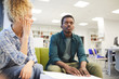 © Seventyfour - Portrait of young African-American man reading braille while studying with seeing friend in school library, copy space