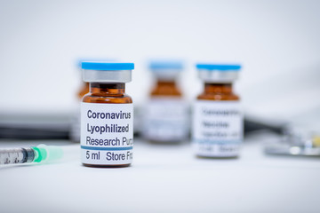 Illustrative vial with labels as coronavirus sample