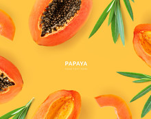 Creative Layout Made Of Papaya And Leaves. Flat Lay. Food Concept. Papaya On Yellow Background.