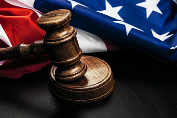 Wall Mural - Gavel on wooden table with USA flag