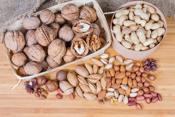 Wall Mural - Top view of the various shelled and unpeeled nuts