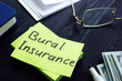 Burial Insurance memo on the green sheet and money.