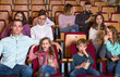 © JackF - Number of people enjoying film screening and popcorn