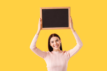 Sticker - Young woman with chalkboard on color background