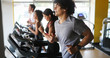 © NDABCREATIVITY - Picture of people running on treadmill in gym