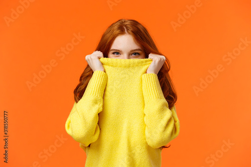 Fotomural Girl hiding from winter cold in her warm soft sweater