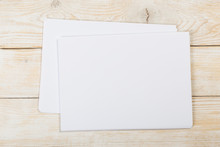 White Paper On Wood Background And Shadow