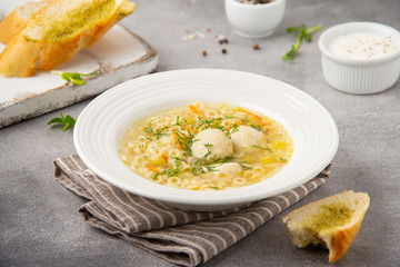 Wall Mural - Soup with meatballs, vegetables and vermicelli. Children's Italian food with pasta and meat (chicken, Turkey)