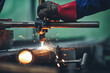 Plasma cutting machine cutting steel pipe with sparks