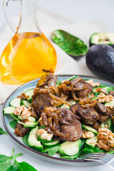 Wall Mural - Salad with chicken liver, spinach, cucumbers, avocado and walnuts.