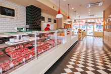Selection Of Raw Fresh Veal Meat In The Refrigerated Display Of A Butcher Shop