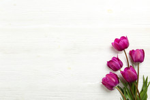 Bunch Of Spring Flowers On Textured Table Backgound With A Lot Of Copy Space For Text. Top View, Close Up, Flat Lay Composition.