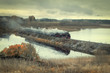 Russia Karelia is the city of Sortavala Historic old steam train with a wagon rides along the embankment of Lake Ladoga
