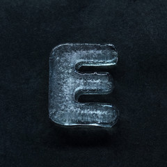Fototapete - Melting speech. Alphabet's shiny and well-structured letters made out of ice isolated on dark studio background. Collect for combine in words. Copyspace to insert your advertising.