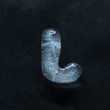 Melting speech. Alphabet's shiny and well-structured letters made out of ice isolated on dark studio background. Collect for combine in words. Copyspace to insert your advertising.
