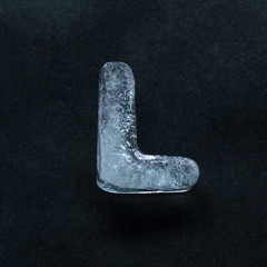Fototapete - Melting speech. Alphabet's shiny and well-structured letters made out of ice isolated on dark studio background. Collect for combine in words. Copyspace to insert your advertising.