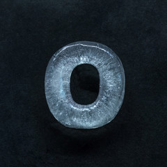 Melting speech. Alphabet's shiny and well-structured letters made out of ice isolated on dark studio background. Collect for combine in words. Copyspace to insert your advertising.