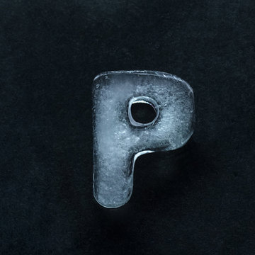Melting speech. Alphabet's shiny and well-structured letters made out of ice isolated on dark studio background. Collect for combine in words. Copyspace to insert your advertising.