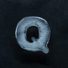 Fototapete - Melting speech. Alphabet's shiny and well-structured letters made out of ice isolated on dark studio background. Collect for combine in words. Copyspace to insert your advertising.