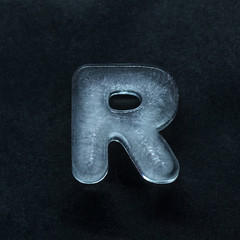 Fototapete - Melting speech. Alphabet's shiny and well-structured letters made out of ice isolated on dark studio background. Collect for combine in words. Copyspace to insert your advertising.