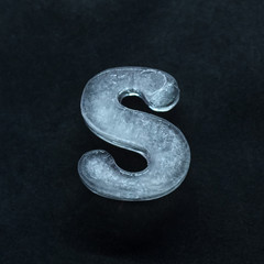 Fototapete - Melting speech. Alphabet's shiny and well-structured letters made out of ice isolated on dark studio background. Collect for combine in words. Copyspace to insert your advertising.