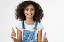 Adorable African Little Girl On Studio White Background Showing Thumbs Up