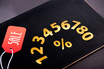 Poster - golden numbers with percent sign and red price tag with sale lettering on black background