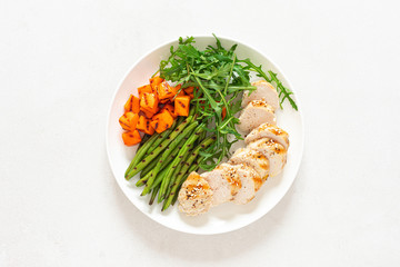 Wall Mural - Grilled chicken breast, fillet with butternut squash or pumpkin, green beans and fresh arugula salad, healthy food, top view