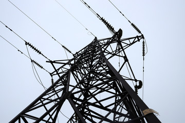 Electrical voltage. Power lines and sky. High voltage.