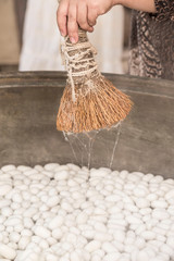 Wall Mural - boiling silkworm cocoons to produce silk rope