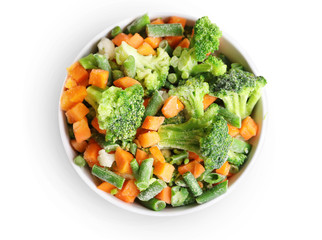 Wall Mural - Frozen vegetables in bowl isolated on white. Top view