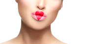 Close-up On Female Model Face With Heart Painted On Pink Fleshy Lips. Valentines Day