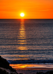 Poster - Beautiful ocean sunset with sun reflections on the ocean water..