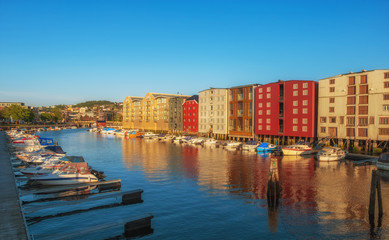 Wall Mural - TRONDHEIM, NORWAY - july, 2019: Colorful old houses at the Nidelva river embankment in Trondheim, Norway.