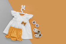 White Dress,  Orange Shorts With Kids Shoes And Sunglasses. Set Of  Baby Clothes And Accessories For Spring Or Summer . Fashion Childs Outfit. Flat Lay, Top View