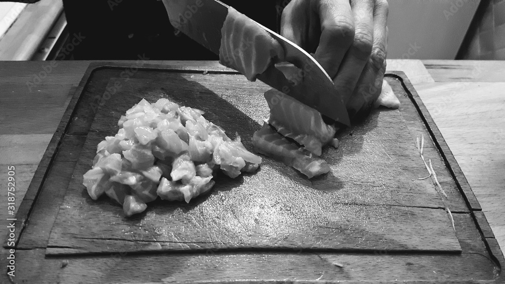 Cropped Image Of Hand Cutting Meat On Board - obrazy, fototapety, plakaty 