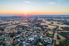 Rural Road Winding Through Pastures And Small Town In Australian Countryside - Aerial Panorama